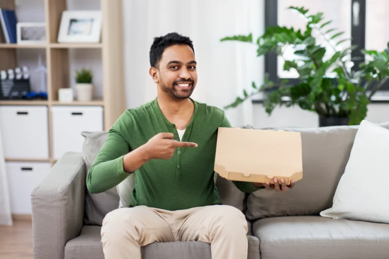 indian-man-with-box-takeaway-pizza-home